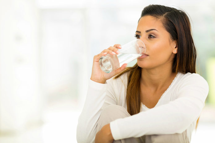 young woman drinking water