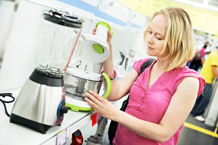 woman shopping at home appliance supermarket